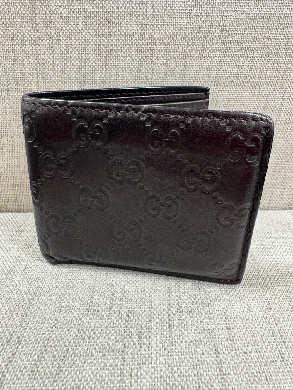 Gucci Dark Brown Embossed GG Leather Bifold Wallet
